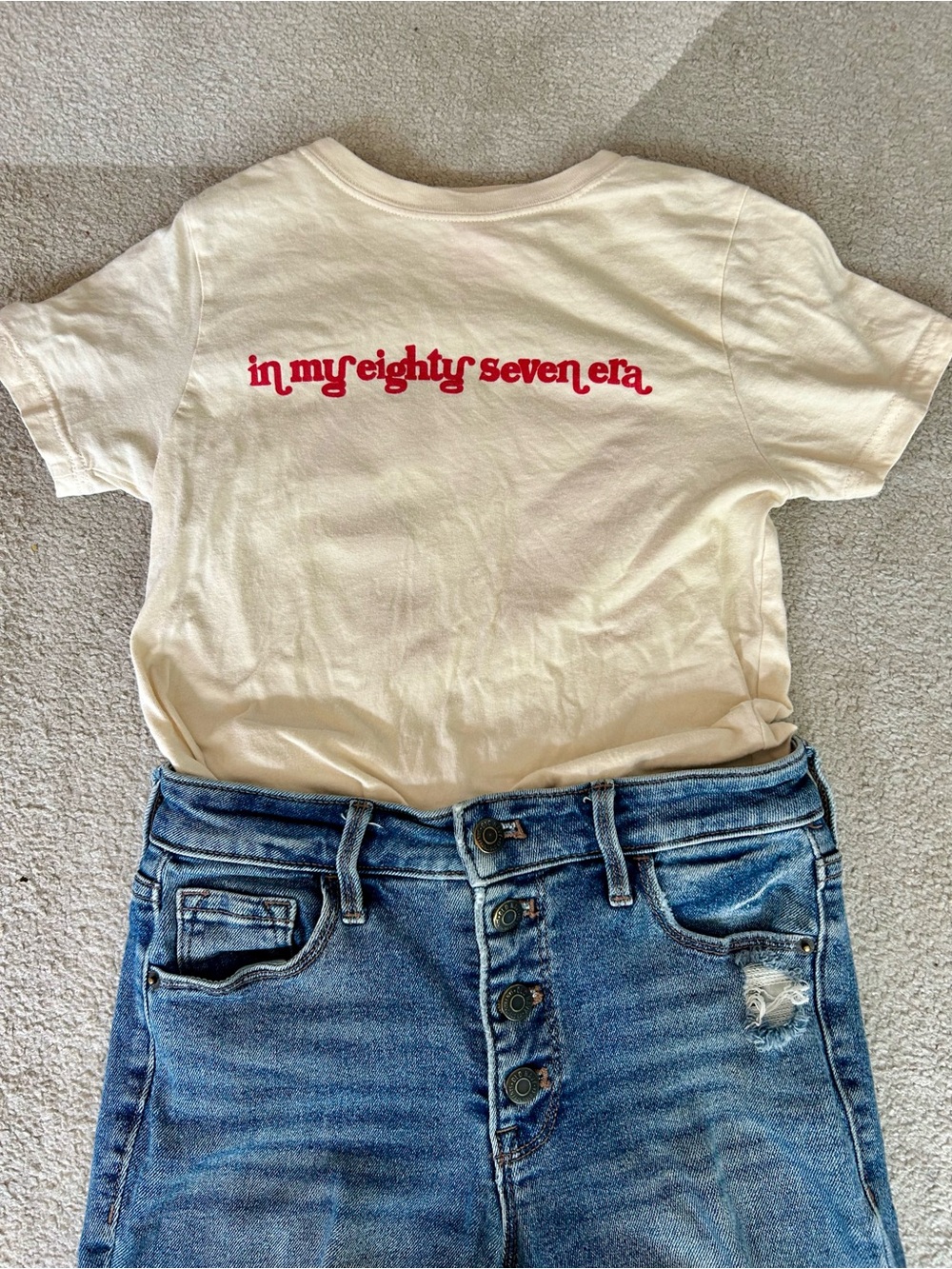 In my 87 era Cream Short-Sleeve Tee with Red Script Graphic